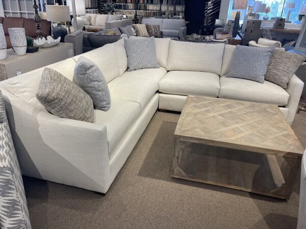 Bradford Sectional with colorful pillows shown in an off white performance fabric.
